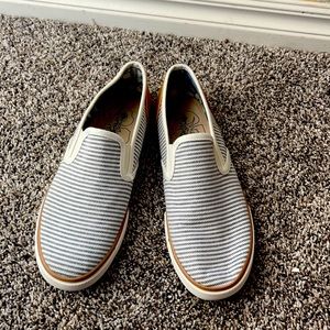 Blue and white striped slip ons